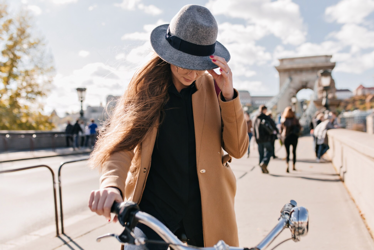 A woman enjoying an Emily in Paris bike tour with OneBike